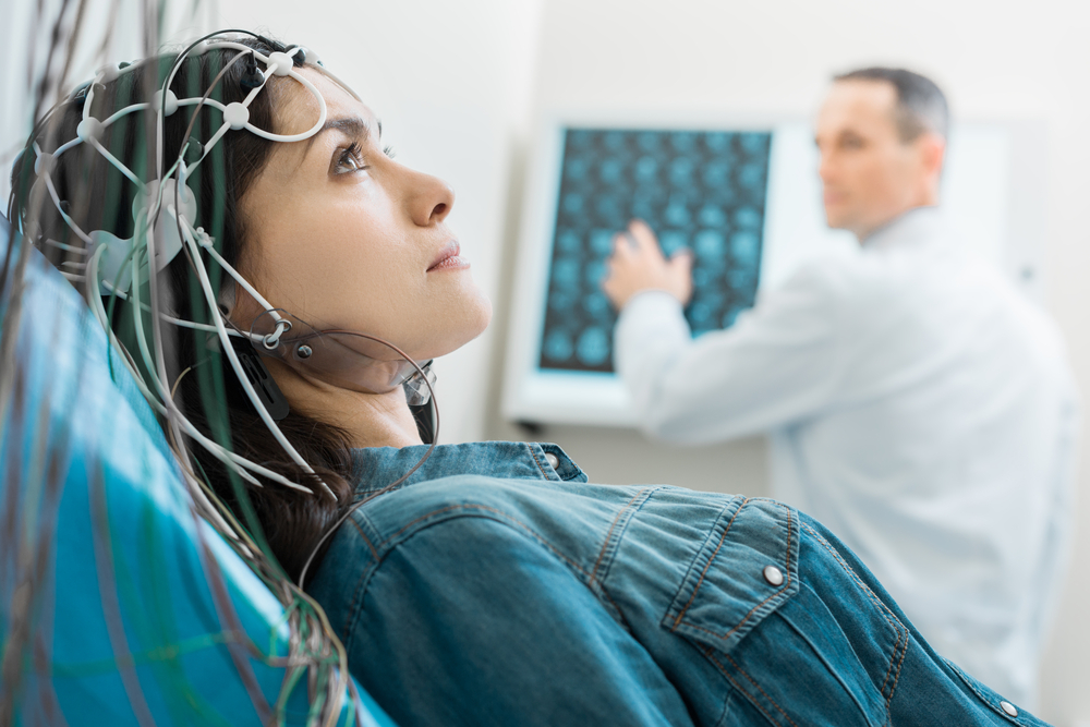 woman getting an EEG test as part of her depression treatment with MeRT