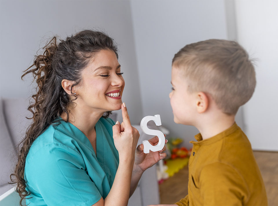 Speech therapist with autistic boy