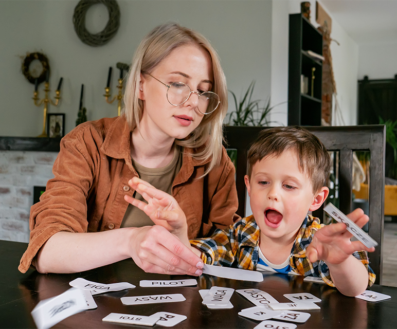 Mom with kid and flash cards